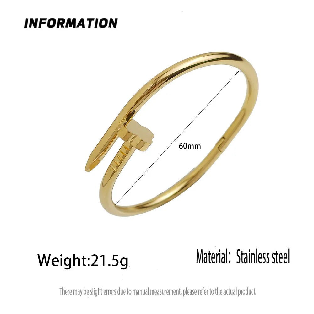 Gold stainless steel open cuff bangle bracelet with a 60mm measurement indicator, weight of 21.5g, and material specification on a white background./ sasha jewels 